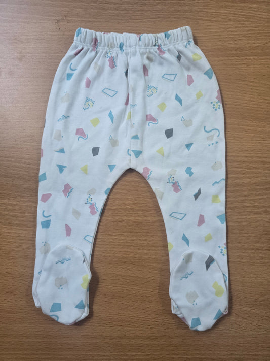 Baby's pants with attached shoe - white shapes