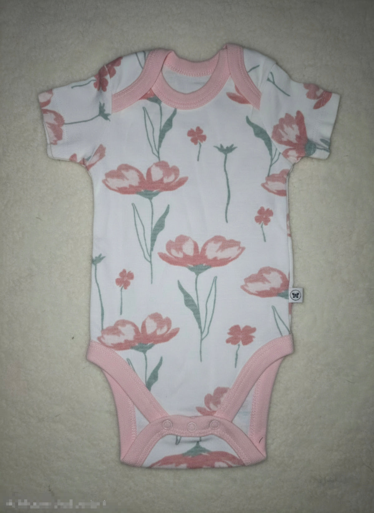 Baby's rompers - pink blossom plant
