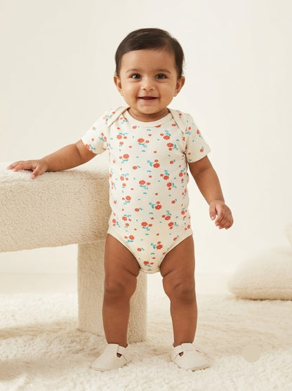 Baby's rompers - White with orange flowers
