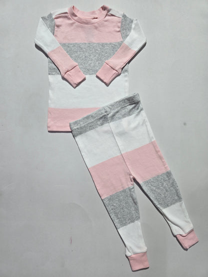 Color-blocked fabric with pink, gray, and white sections on a gray background