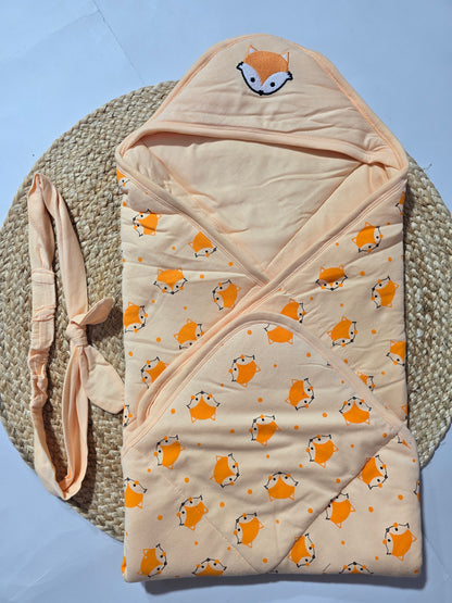 Baby wrap with fox pattern on a textured surface